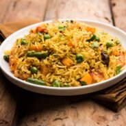 Tawa Pulao or Pulav or Pilaf or Pilau is an Indian Street Food  made using basmati rice, vegetables and spices. Selective focus