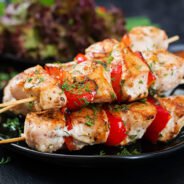 Chicken skewers with slices of sweet peppers and dill. Tasty food. Weekend meal.