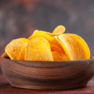 high-resolution-photo-homemade-delicious-crispy-potato-chips-small-brown-bowl-dark-background